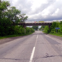 Железнодорожный мост над трассой Н16-налево поворот на Умань,прямо Звенигородка.