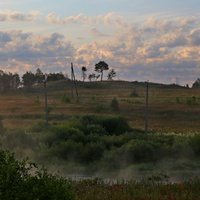 За рекой.