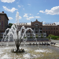 около универмага.