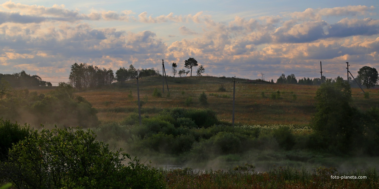 За рекой.